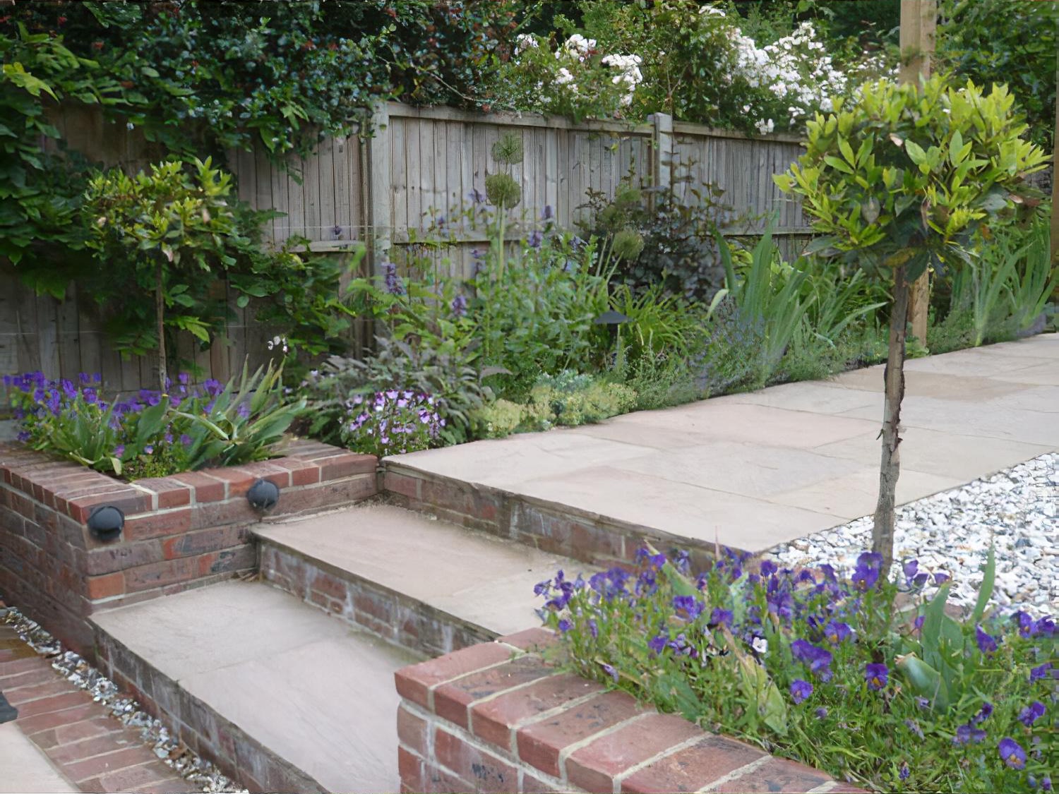 Sloping, long thin garden by garden designer Andrea Newill MSGD